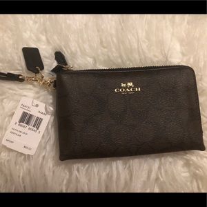 COACH monogram PVC wristlet